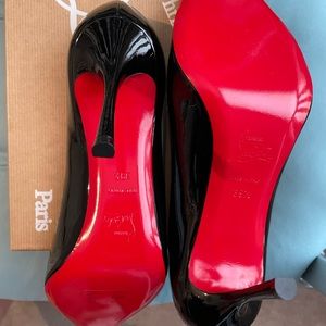Christian Louboutin black patent red sole pumps